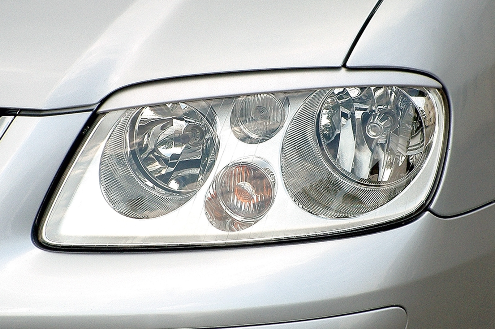 Paupières de phares avants (la paire) pour VW Touran toutes carrosseries (2003-2006) - Fabriqué en ABS (à peindre)