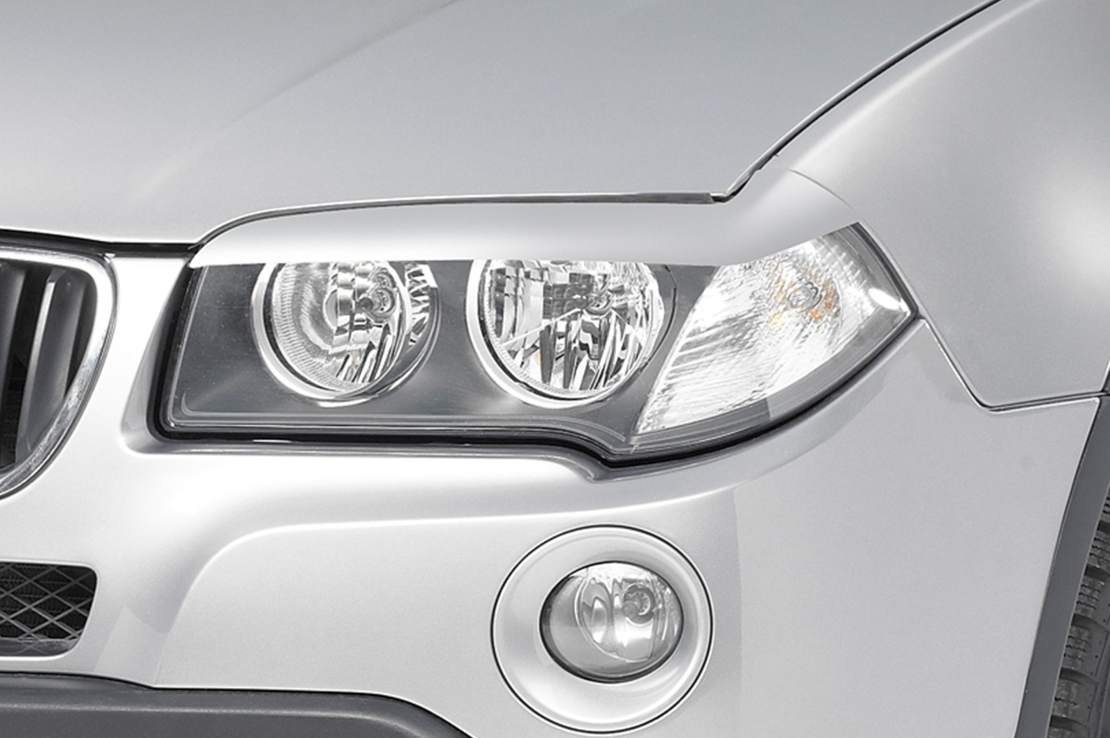 Paupières de phares avants (la paire) pour BMW X3 E83 toutes carrosseries (2003-2010) - Fabriqué en ABS (à peindre)