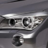 Paupières de phares avants (la paire) pour BMW X1 E84 LCI toutes carrosseries (7/2012-5/2015) - Fabriqué en ABS (à peindre)
